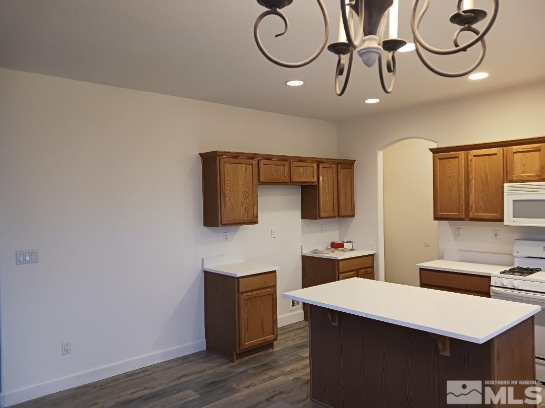2217 Table Rock Drive Carson City, NV 89706 - Photo 7 of 28 a room with a table chairs and a wooden floor