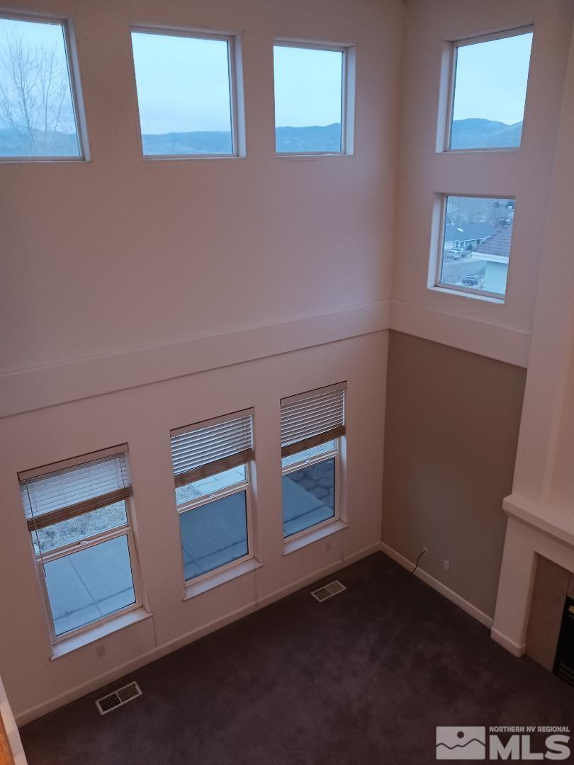 2217 Table Rock Drive Carson City, NV 89706 - Photo 8 of 28 a view of an empty room and wooden floor