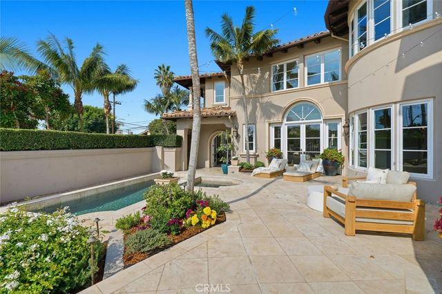 an aerial view of ocean and trees