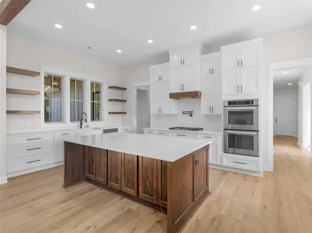 a kitchen with a sink and cabinets