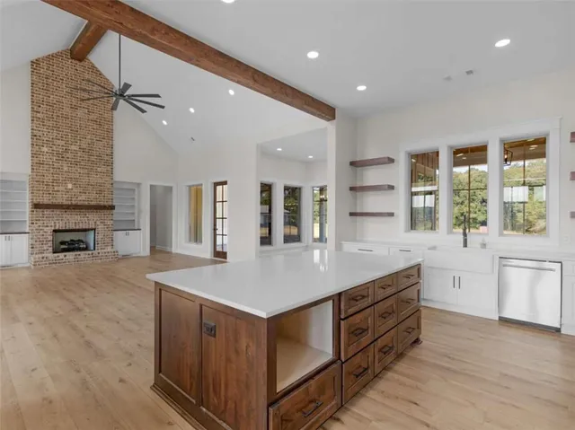 a kitchen with a stove a sink and a refrigerator