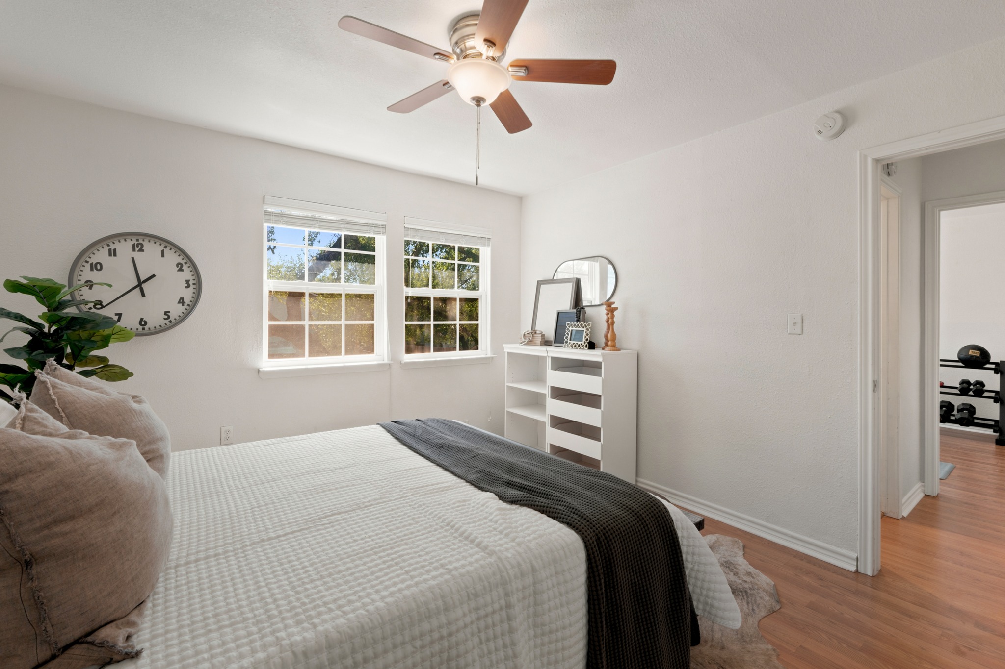 1504 Allen Road, Unit B Austin, TX 78746 - Photo 15 of 24 Natural light pours through dual windows onto warm wood floors.