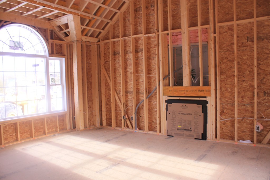 8 Mockingbird Hill Road Groton, MA 01450 - Photo 3 of 11 a view of a room with a window and a wooden door
