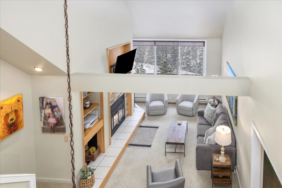 21650 Highway 6, Unit 2106 Keystone, CO 80435 - Photo 15 of 44 a living room with furniture and wooden floor