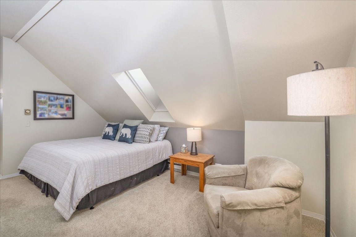 21650 Highway 6, Unit 2106 Keystone, CO 80435 - Photo 26 of 44 a bedroom with a bed and a couch