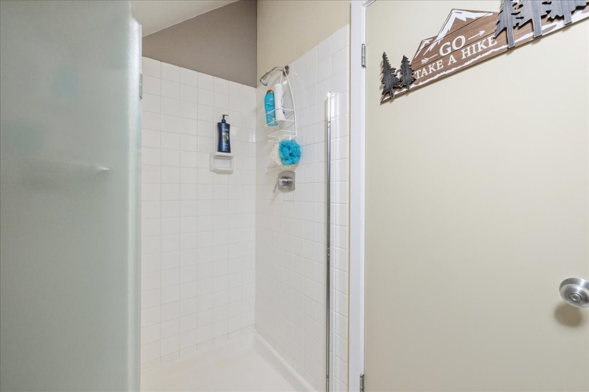 21650 Highway 6, Unit 2106 Keystone, CO 80435 - Photo 27 of 44 a bathroom with a shower and a mirror