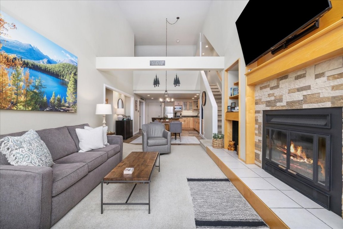21650 Highway 6, Unit 2106 Keystone, CO 80435 - Photo 32 of 44 a living room with furniture and a fireplace