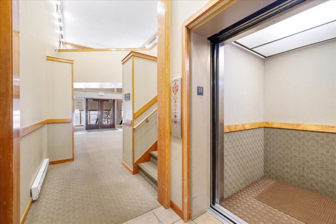 21650 Highway 6, Unit 2106 Keystone, CO 80435 - Photo 33 of 44 a view of a hallway with the door and furniture