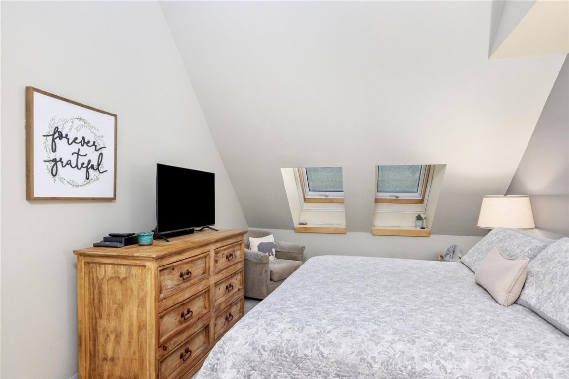 21650 Highway 6, Unit 2106 Keystone, CO 80435 - Photo 37 of 44 a bedroom with a bed and a flat screen tv