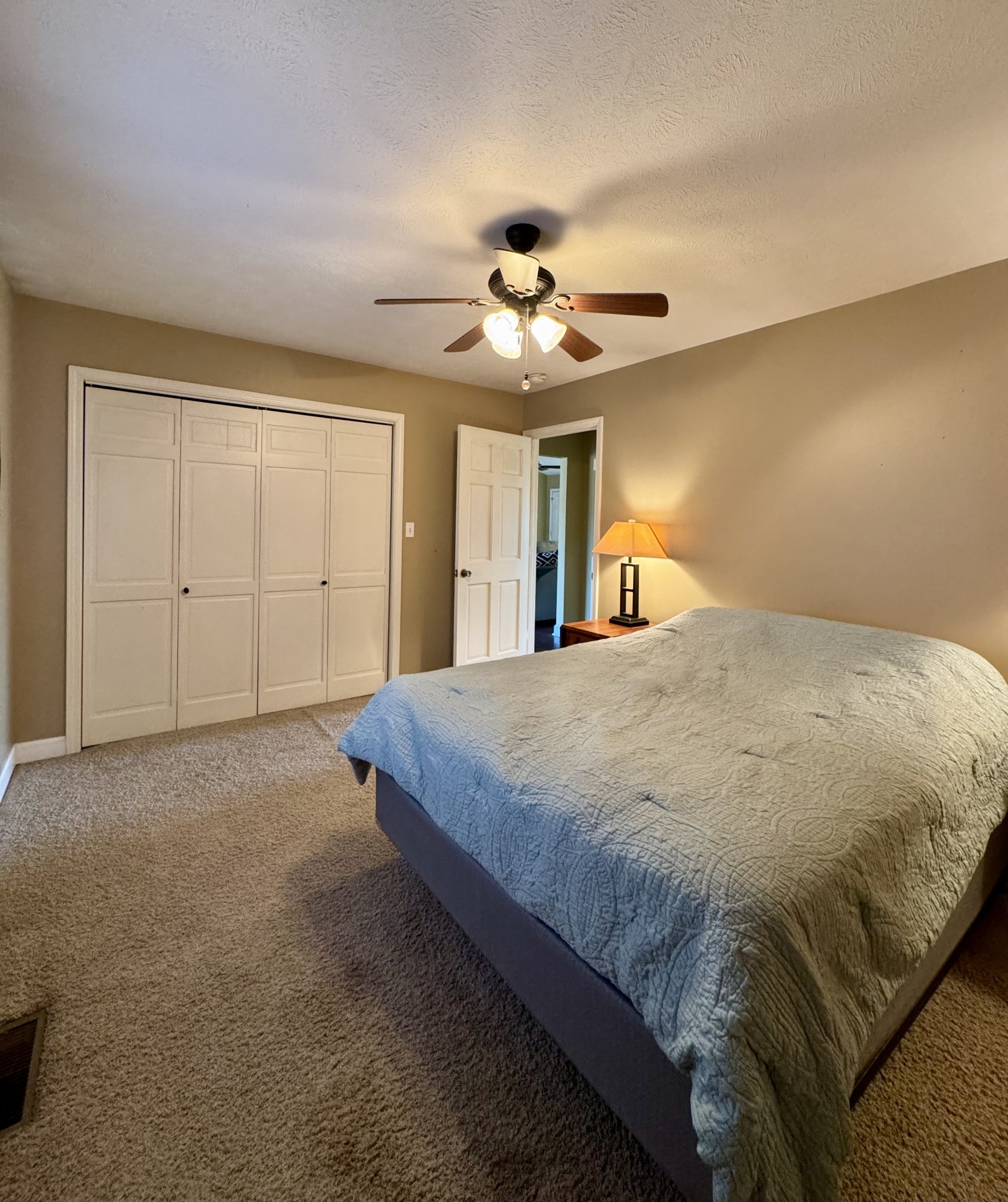 2235 Hagler Ridge Road Springville, TN 38256 - Photo 13 of 20 a spacious bedroom with a bed and a ceiling fan
