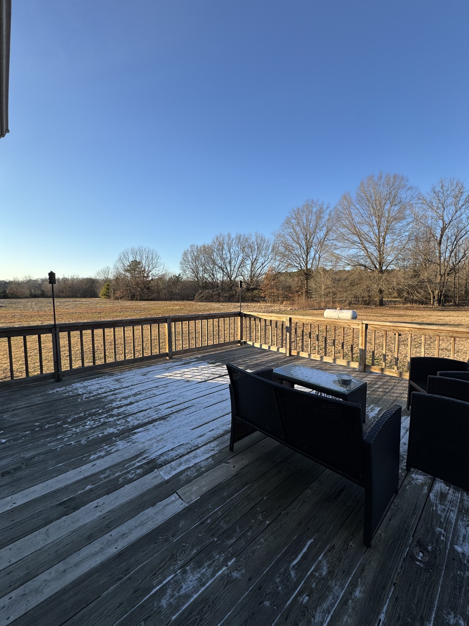 2235 Hagler Ridge Road Springville, TN 38256 - Photo 20 of 20 a view of a balcony with wooden floor and with chairs