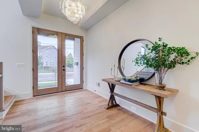 a view of a livingroom with furniture and hardwood floor