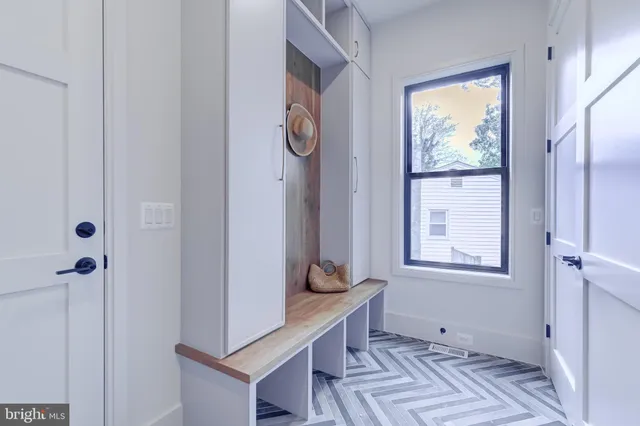 a view of a house with a big yard and large trees