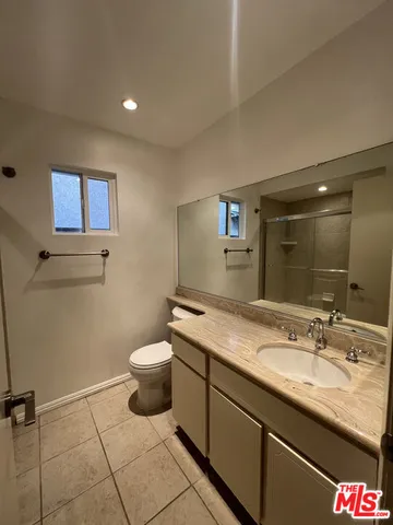 a bathroom with a shower and a bathtub