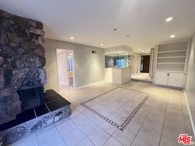 wooden floor in a hall with an entryway