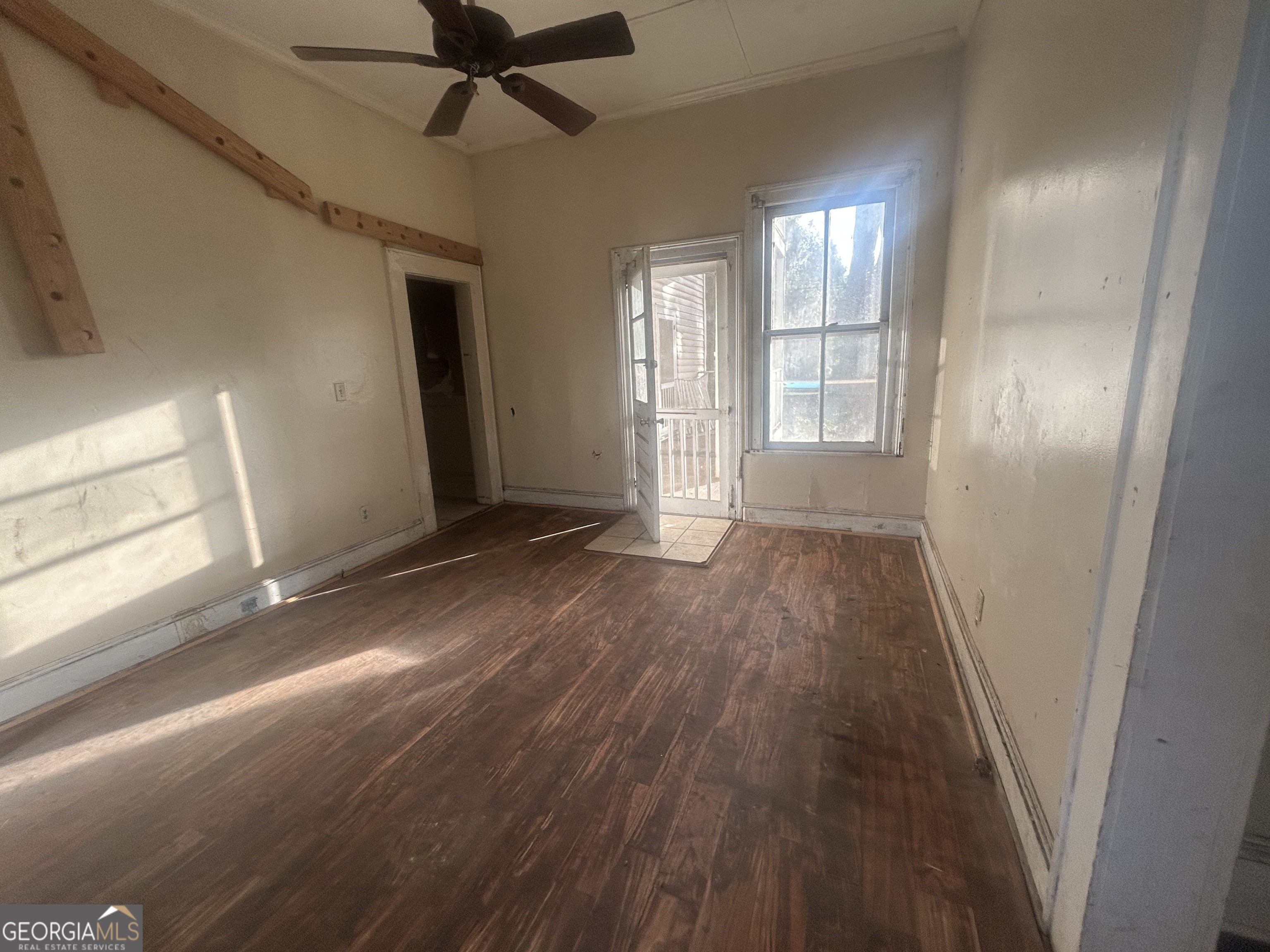 508 Albemarle Street, Unit AD Brunswick, GA 31520 - Photo 17 of 45 a view of empty room with wooden floor and fan