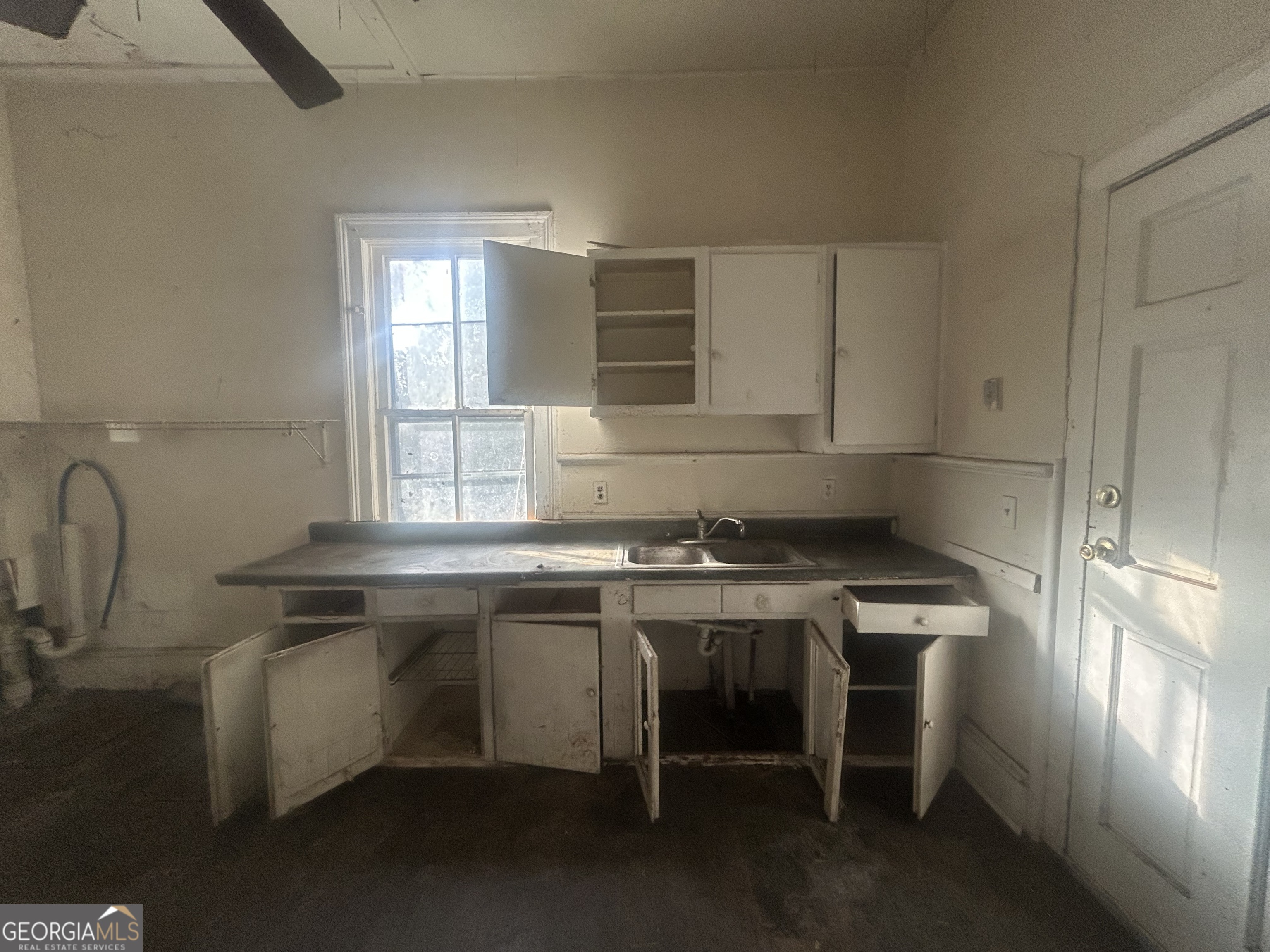 508 Albemarle Street, Unit AD Brunswick, GA 31520 - Photo 19 of 45 a kitchen with stainless steel appliances granite countertop a sink stove and cabinets