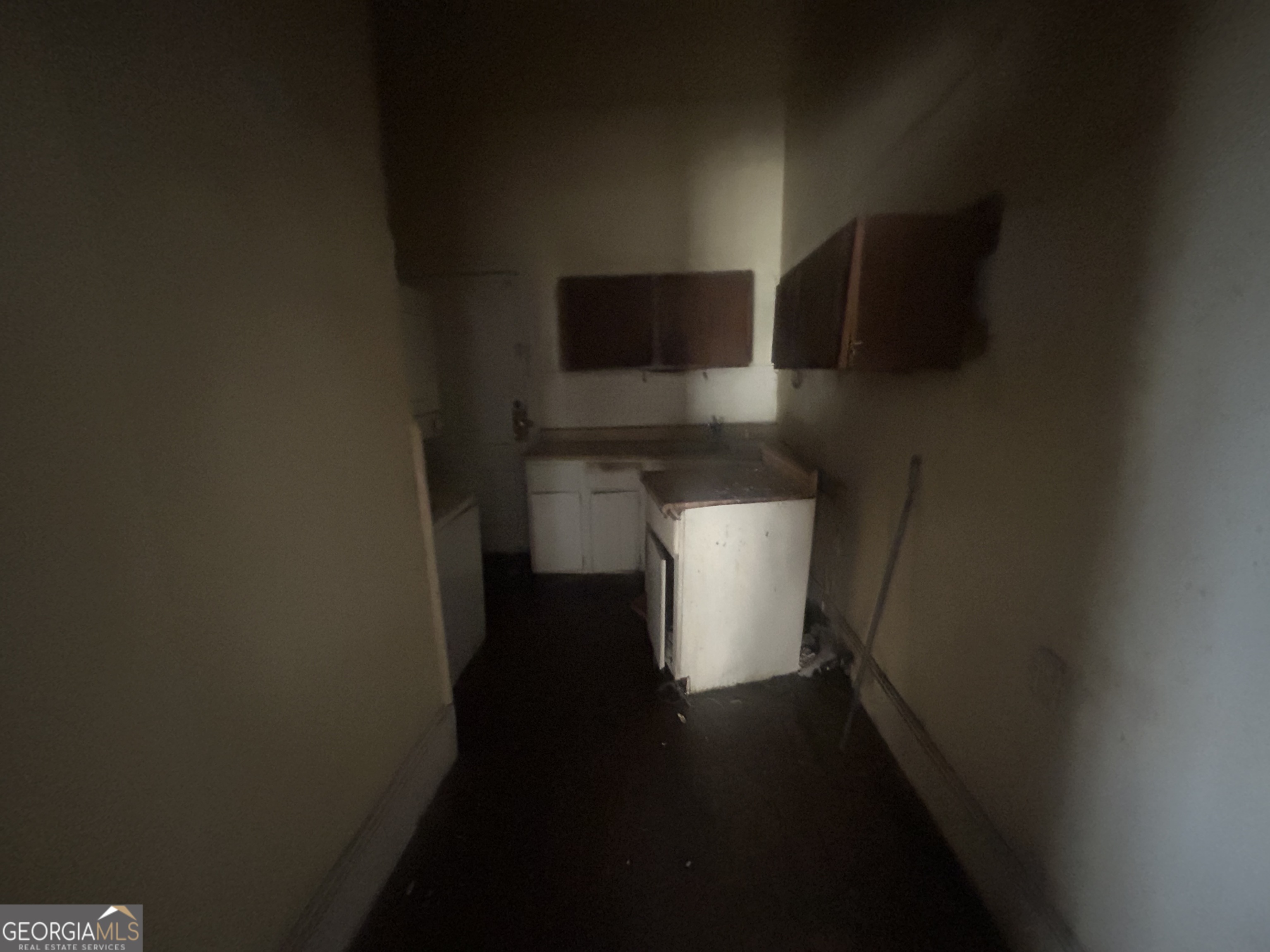 508 Albemarle Street, Unit AD Brunswick, GA 31520 - Photo 26 of 45 a view of a kitchen with wooden floor and a window