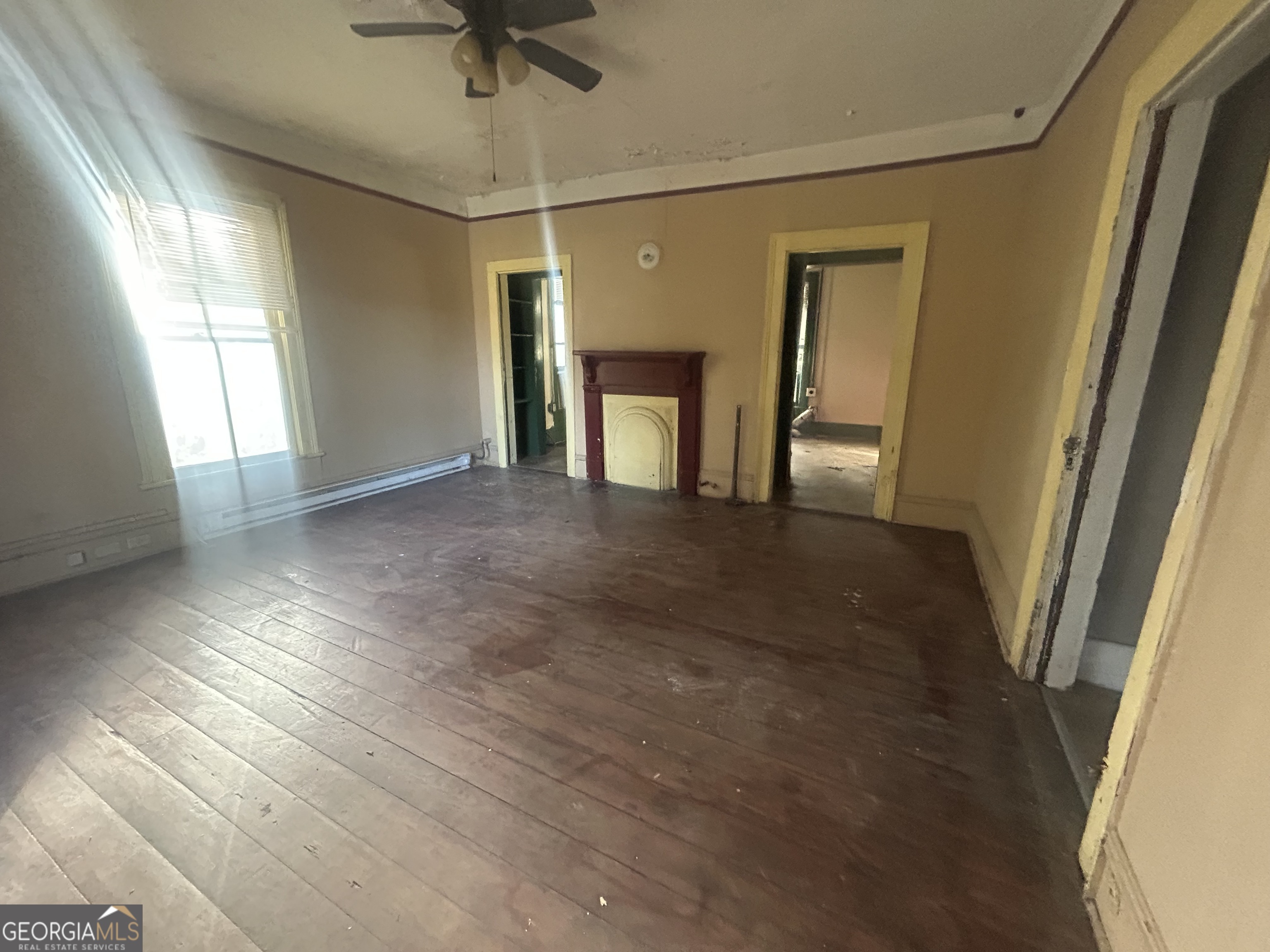 508 Albemarle Street, Unit AD Brunswick, GA 31520 - Photo 30 of 45 a view of empty room with wooden floor and fan