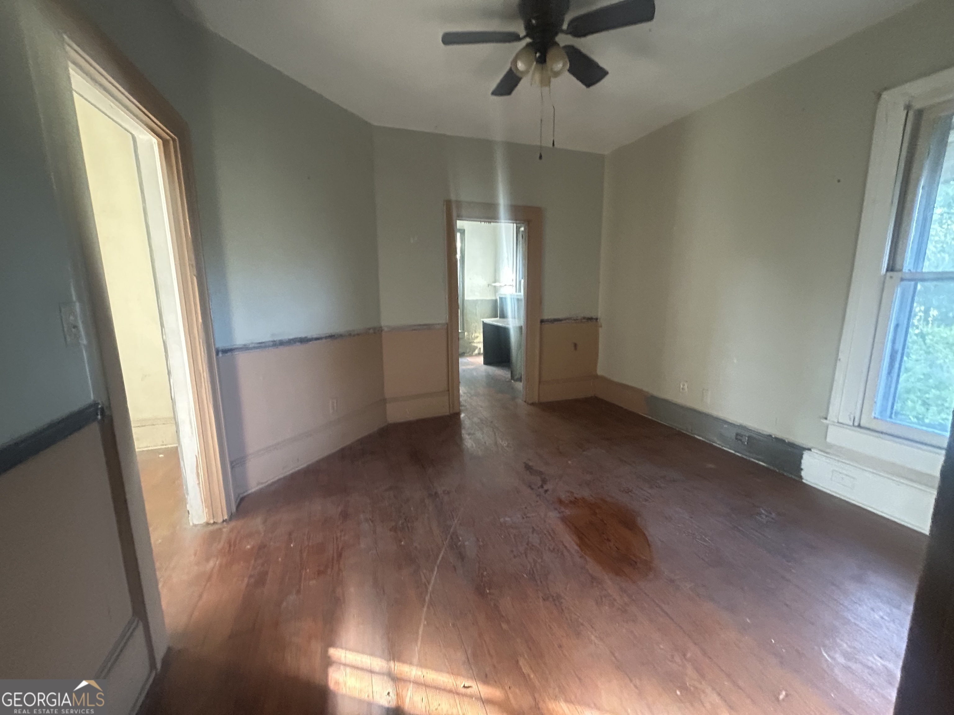 508 Albemarle Street, Unit AD Brunswick, GA 31520 - Photo 37 of 45 an empty room with wooden floor fan and windows