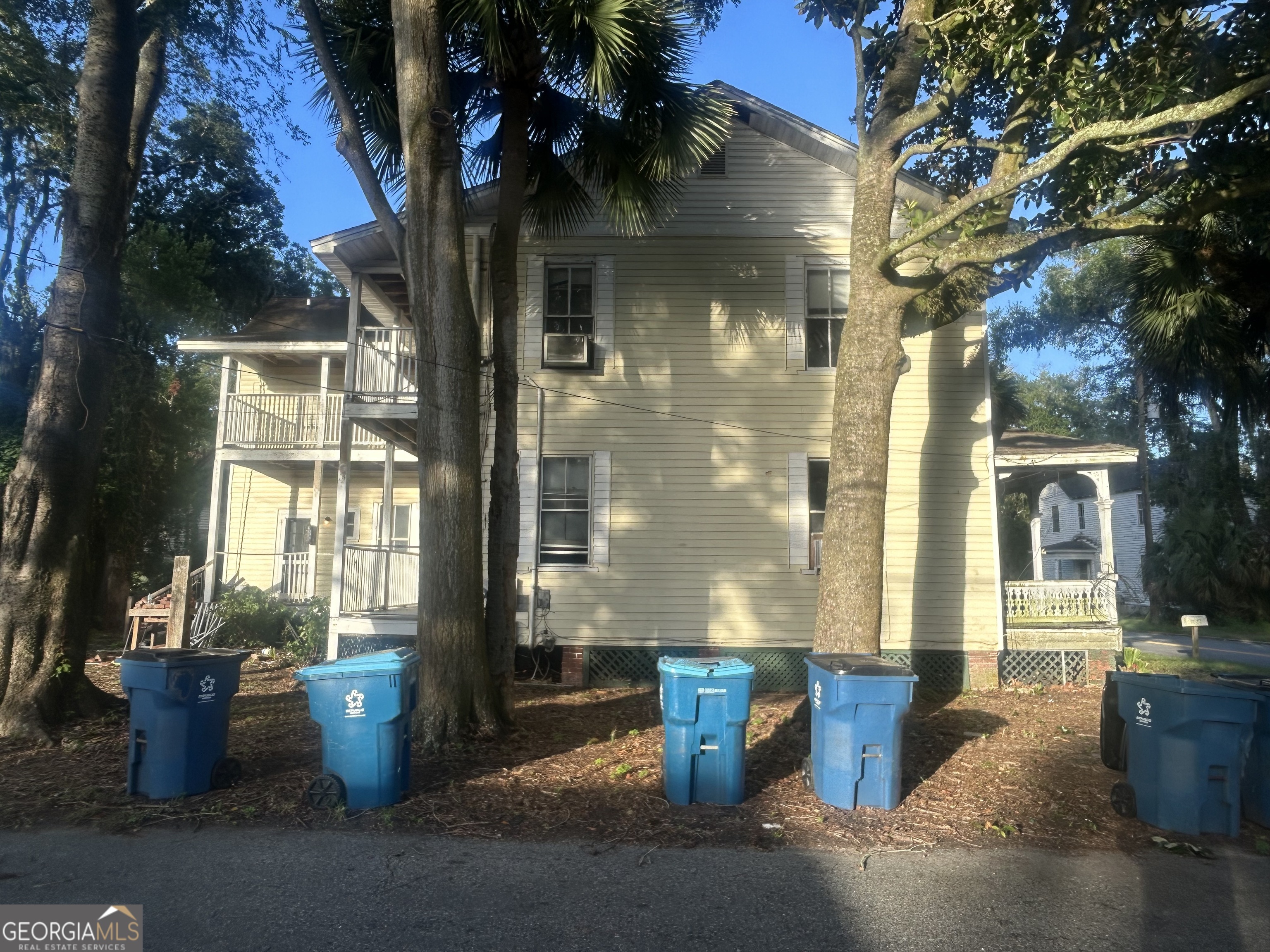 508 Albemarle Street, Unit AD Brunswick, GA 31520 - Photo 44 of 45 a view of a house with barbeque grill and potted plants