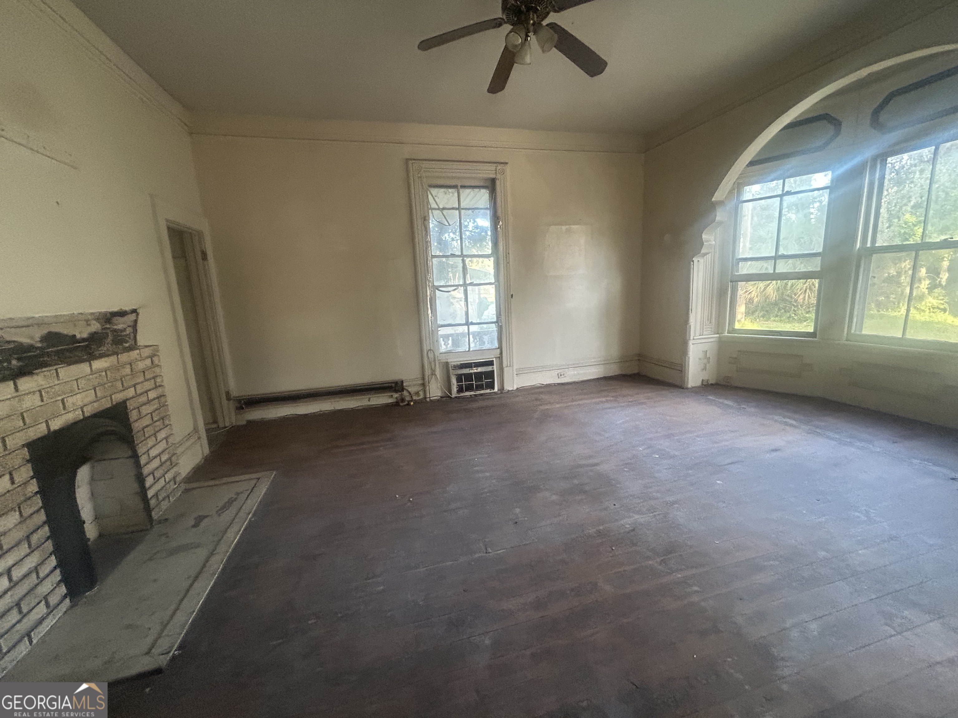 508 Albemarle Street, Unit AD Brunswick, GA 31520 - Photo 8 of 45 an empty room with fireplace and windows