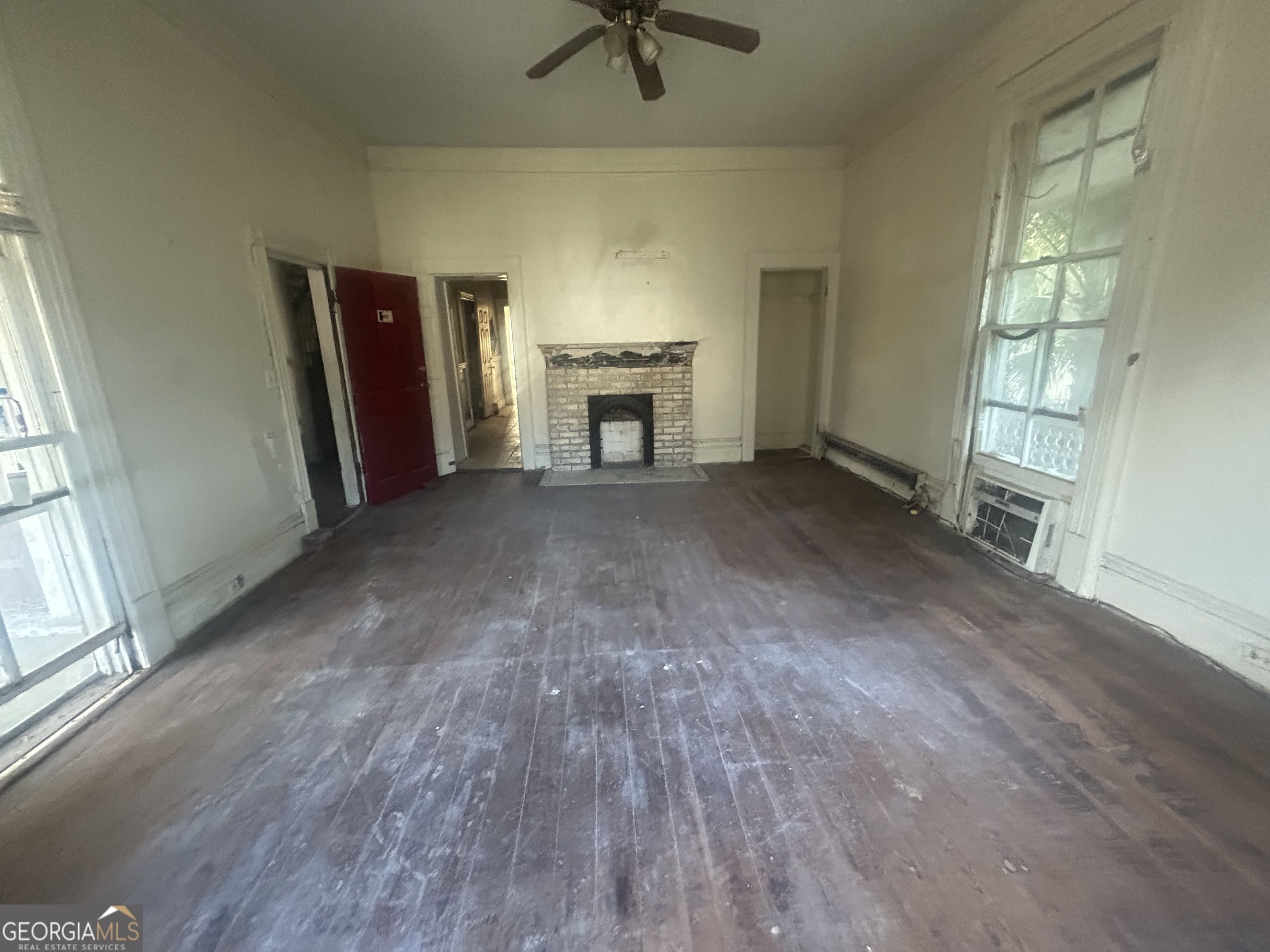 508 Albemarle Street, Unit AD Brunswick, GA 31520 - Photo 9 of 45 an empty room with windows and fireplace