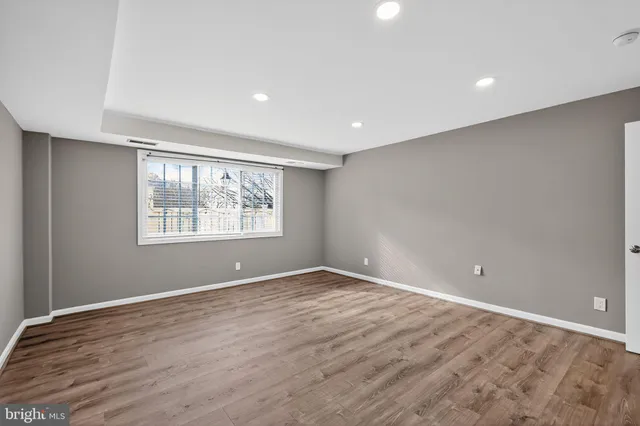 a view of an empty room with windows