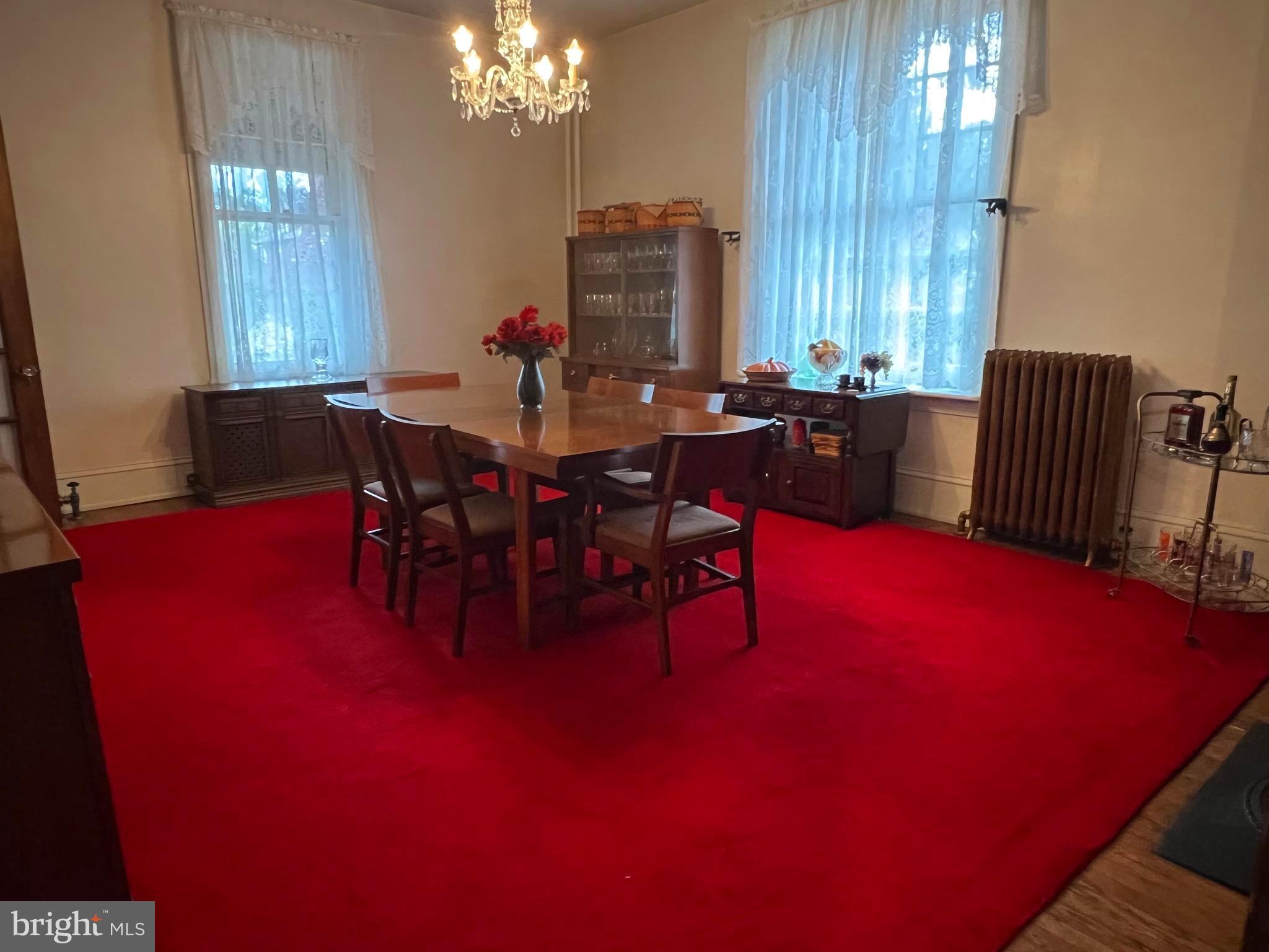 424 Jennings Street Beverly, NJ 08010 - Photo 13 of 43 a view of a dining room with furniture and chandelier