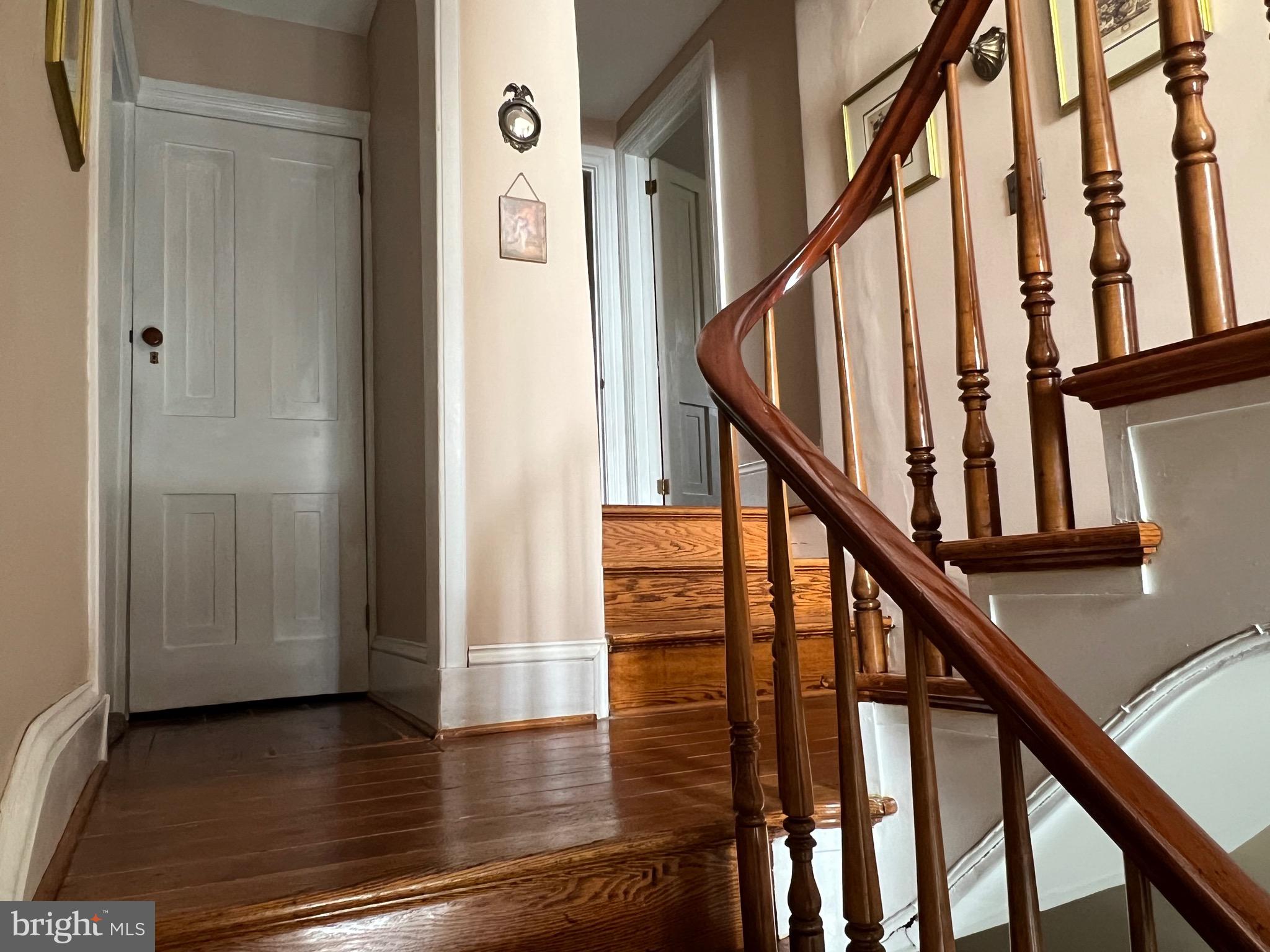 424 Jennings Street Beverly, NJ 08010 - Photo 17 of 43 a view of entryway with wooden floor and stairs