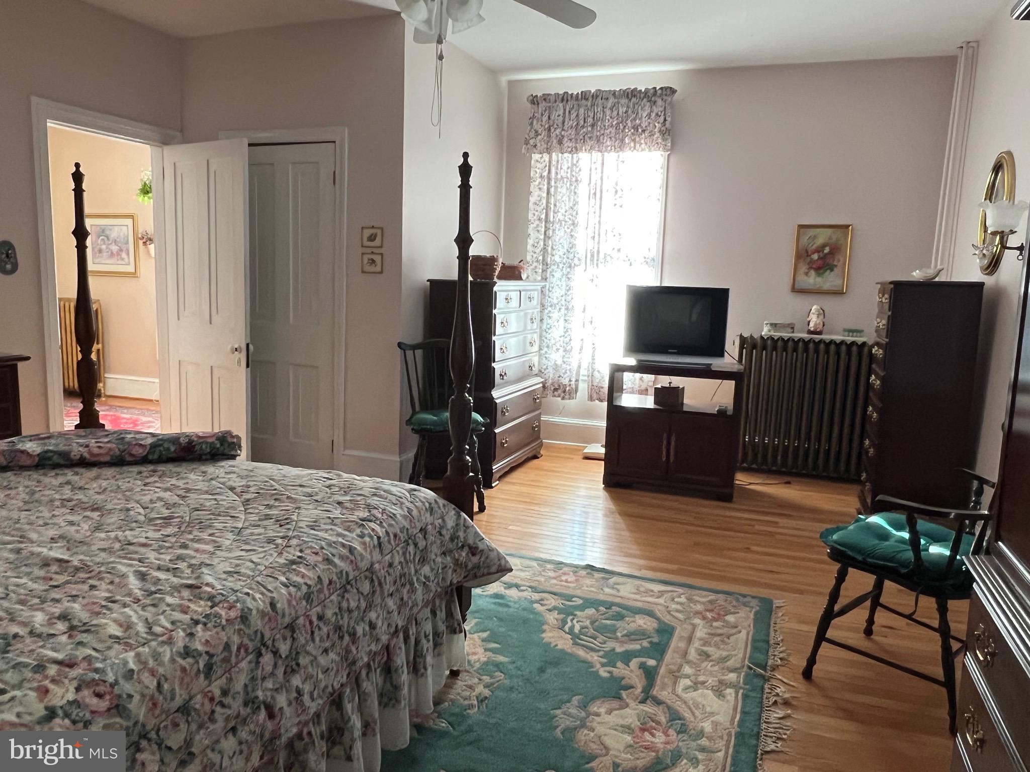 424 Jennings Street Beverly, NJ 08010 - Photo 22 of 43 a bedroom with a bed and a flat screen tv