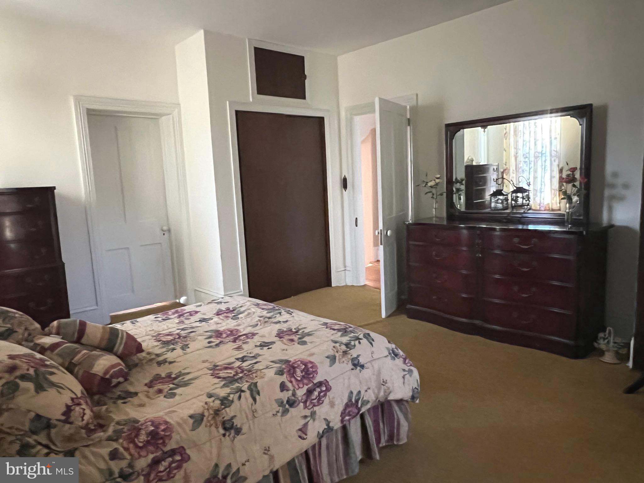 424 Jennings Street Beverly, NJ 08010 - Photo 27 of 43 a bedroom with a bed and a mirror