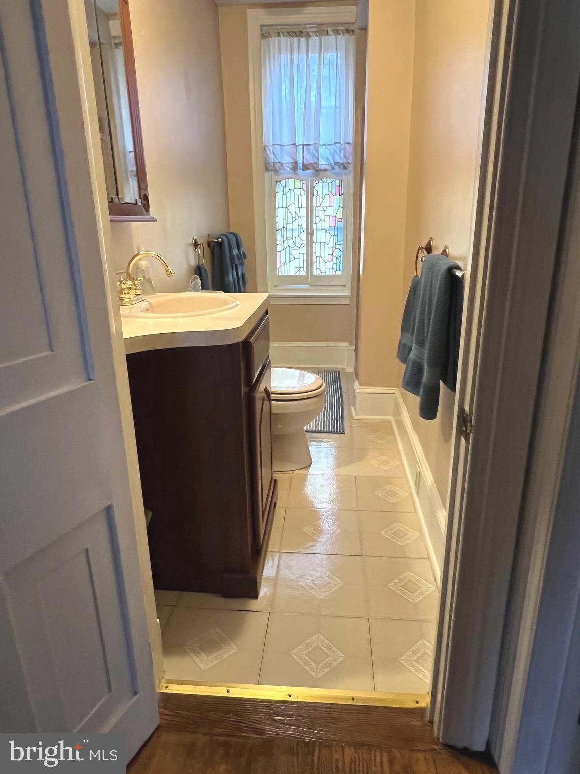 424 Jennings Street Beverly, NJ 08010 - Photo 29 of 43 a bathroom with a sink toilet and tub