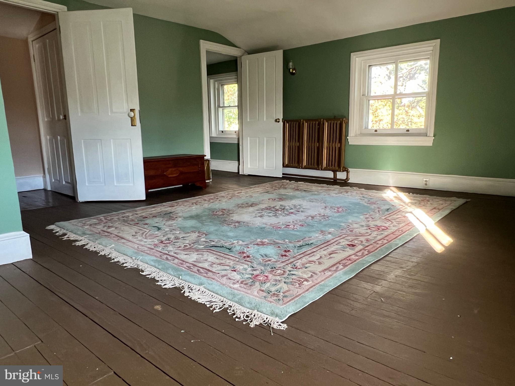 424 Jennings Street Beverly, NJ 08010 - Photo 30 of 43 a view of a livingroom with wooden floor and kitchen space