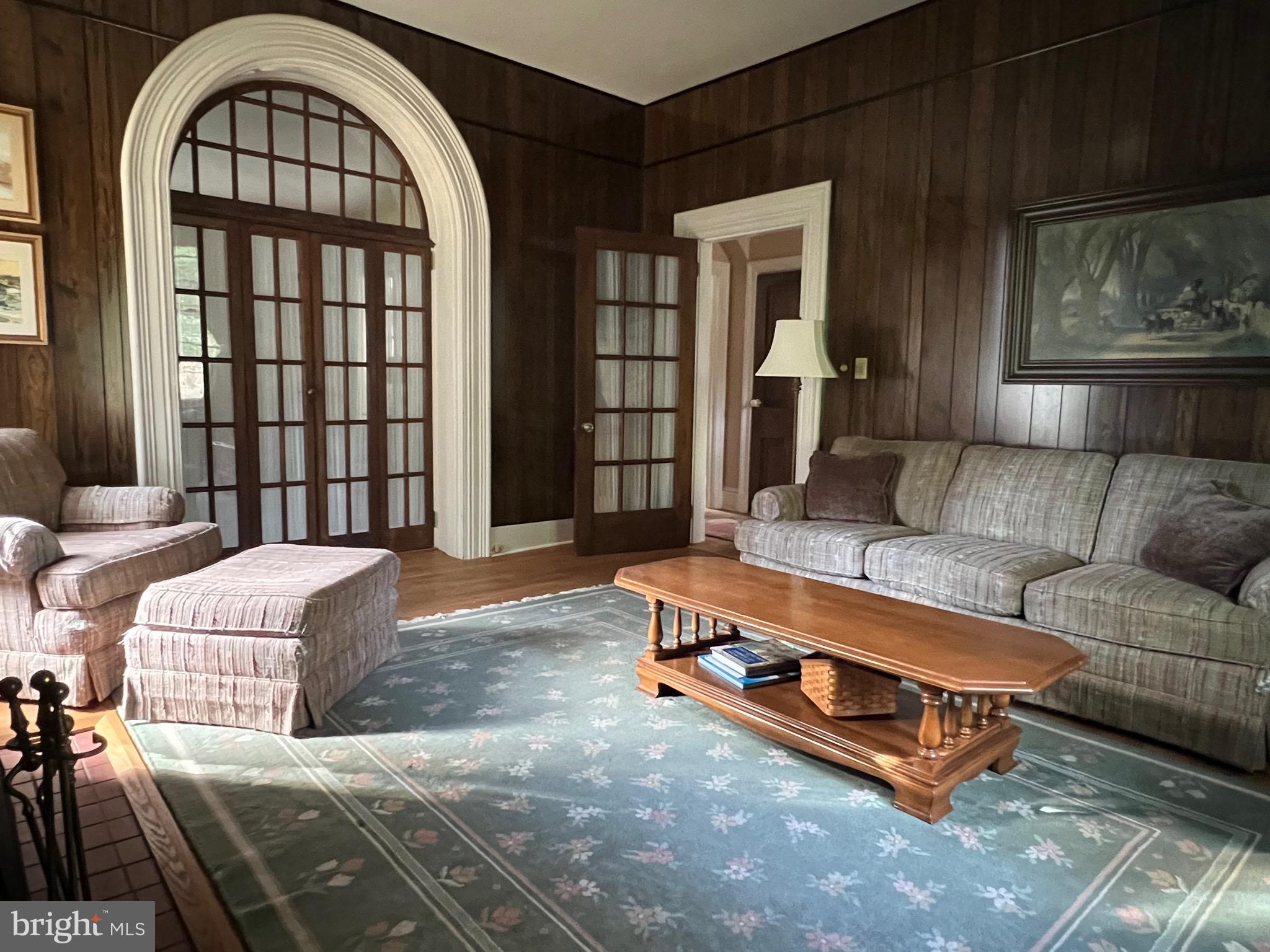 424 Jennings Street Beverly, NJ 08010 - Photo 8 of 43 a living room with a couch dresser and a large window