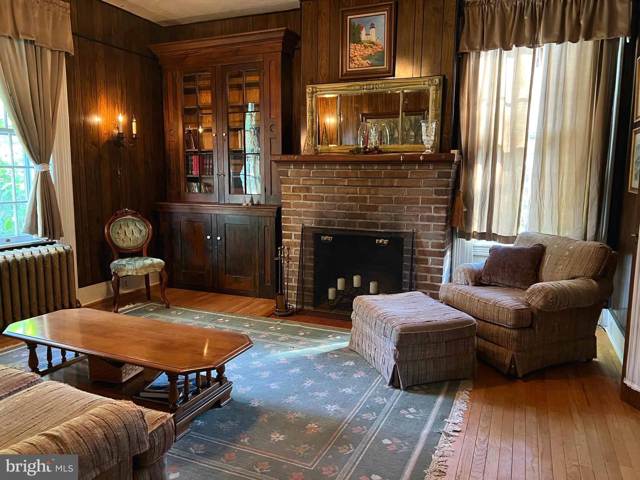 424 Jennings Street Beverly, NJ 08010 - Photo 9 of 43 a living room with furniture and a fireplace