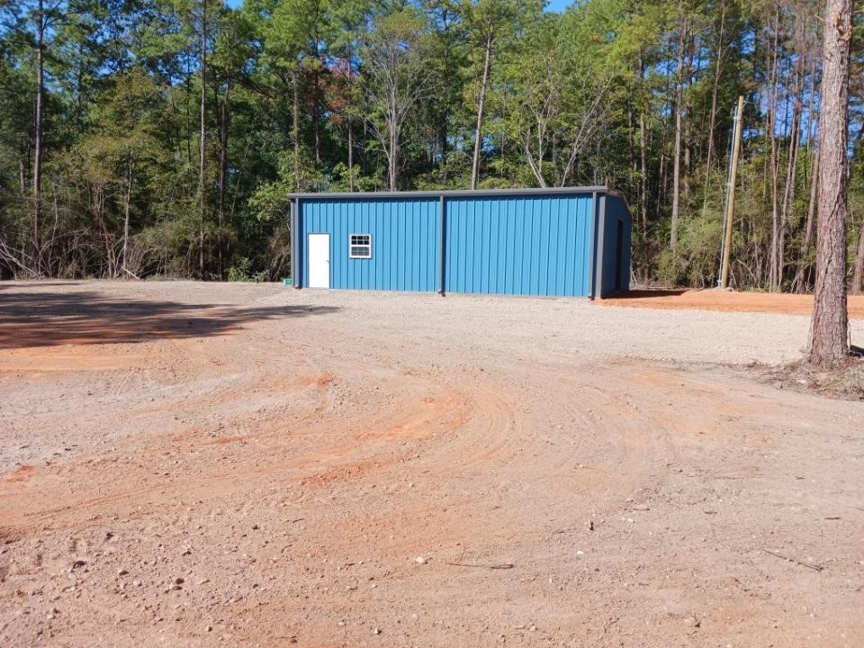 145 Roma Livingston, TX 77351 - Photo 3 of 10 a house with trees in front of it