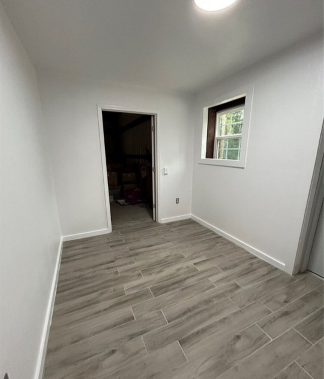 145 Roma Livingston, TX 77351 - Photo 6 of 10 a view of an empty room with wooden floor and closet