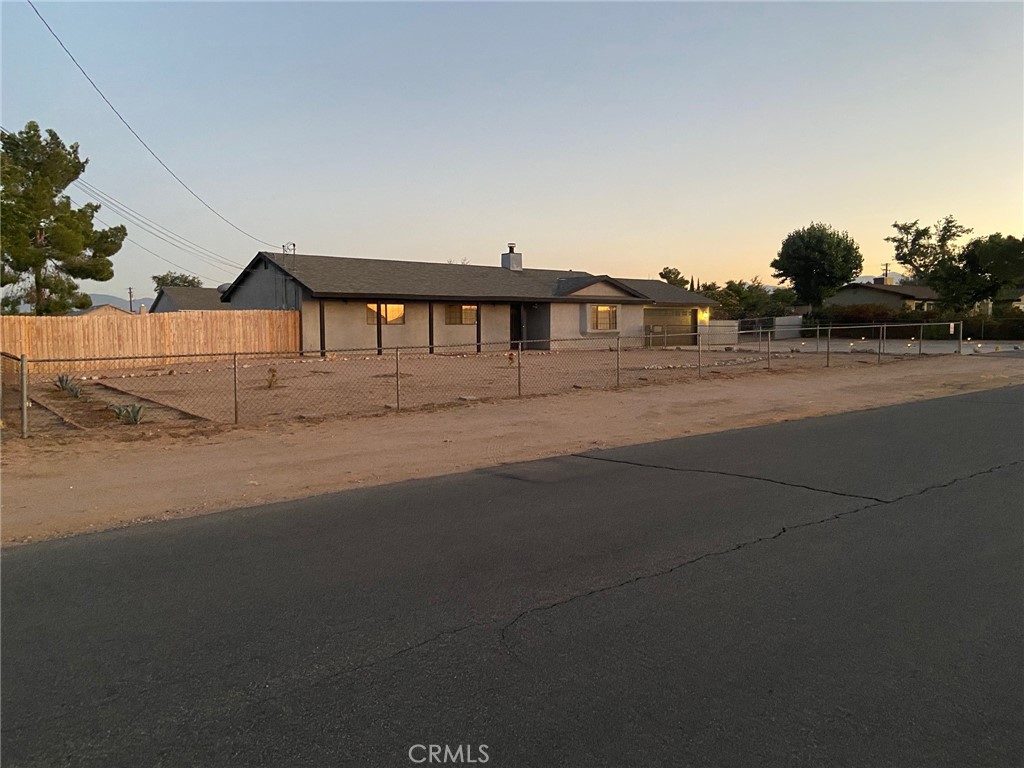 a view of a house with a street