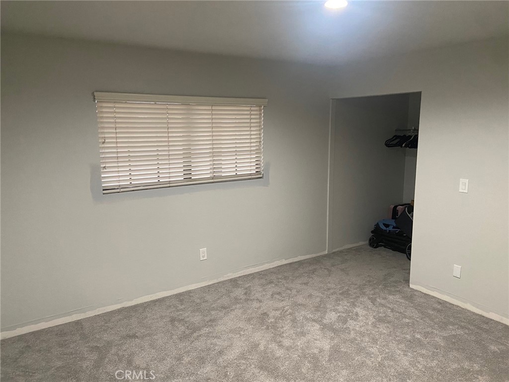 14961 Walnut Street Hesperia, CA 92345 - Photo 12 of 25 an empty room with windows