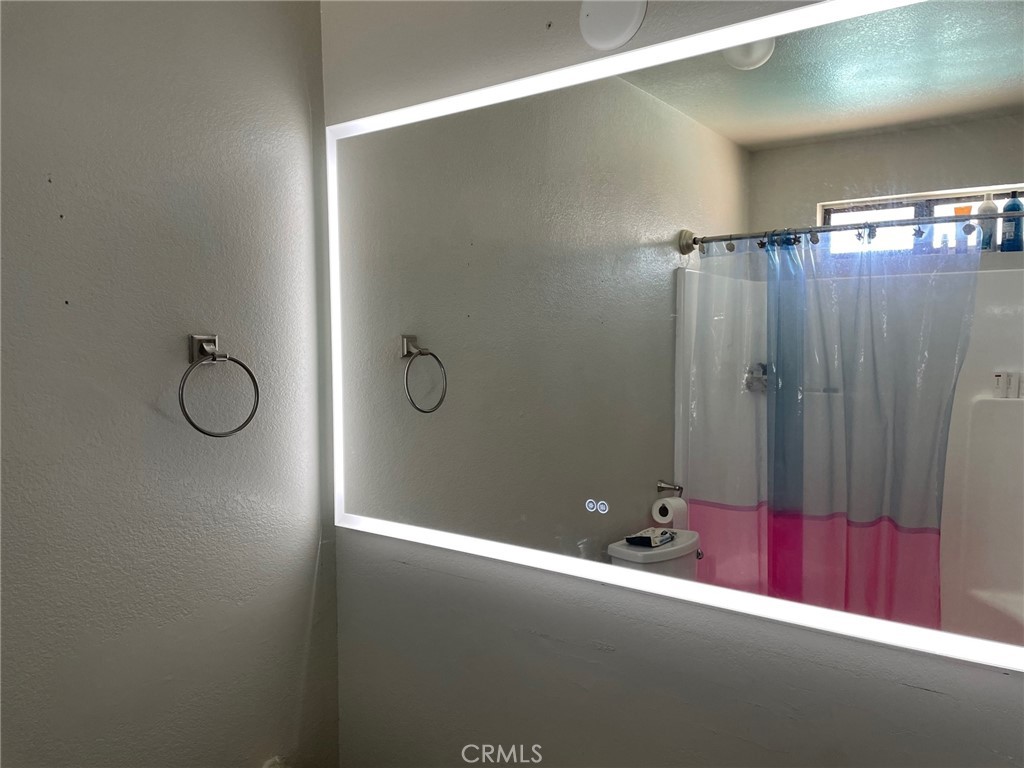 14961 Walnut Street Hesperia, CA 92345 - Photo 13 of 25 a view of a room with wooden walls