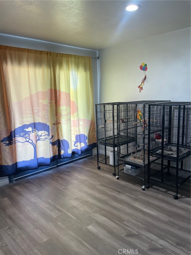 14961 Walnut Street Hesperia, CA 92345 - Photo 6 of 25 a living room with furniture and a window