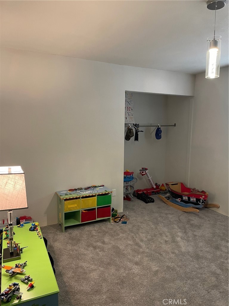 14961 Walnut Street Hesperia, CA 92345 - Photo 10 of 25 a room with toys and dresser with wooden floor