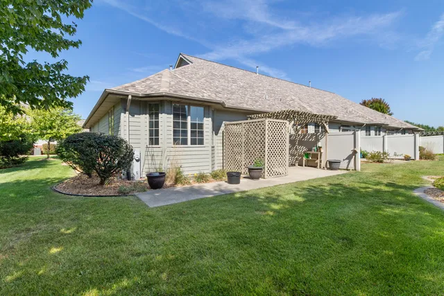 a front view of a house with a yard and porch