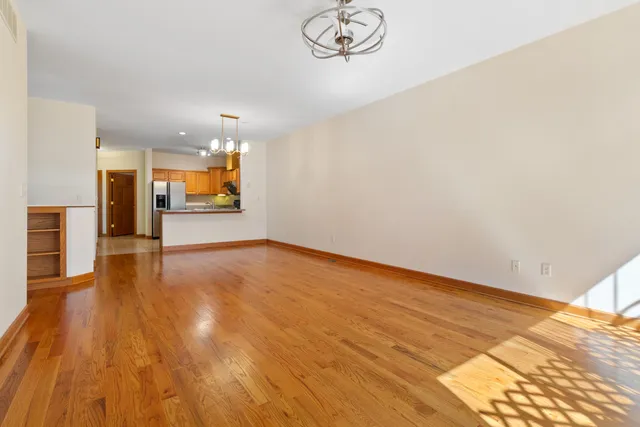 a view of a room with wooden floor