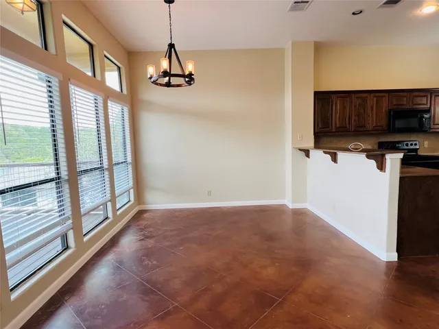 a view of a kitchen with a sink and a window
