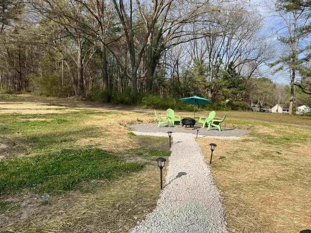 a view of a yard with swimming pool