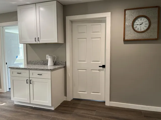 a view of cabinets and wooden floor