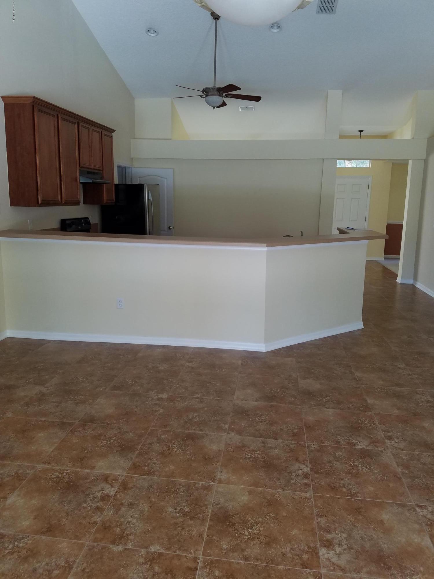 10140 Rising Mist Lane Jacksonville, FL 32221 - Photo 39 of 44 Great Room to Kitchen
