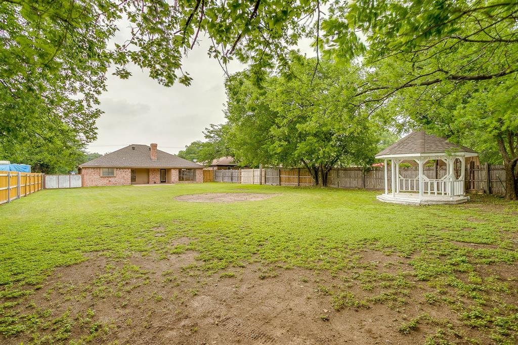 8613 Silver Creek Road White Settlement, TX 76108 - Photo 32 of 40 a front view of a house with a yard
